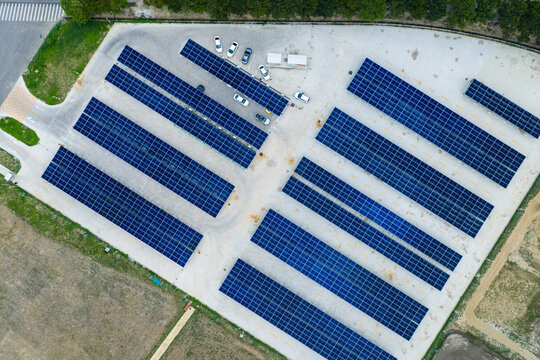 Aerial view of EV charging station with solar panel parking lot