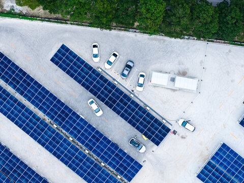 Aerial view of EV charging station with solar panel parking lot