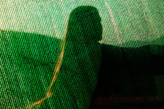 Shadow of a Woman on Textured Fabric