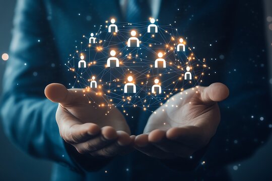 Close up of hands holding a glowing network of diverse people icons representing global connection and community in a digital world - Powered by Adobe