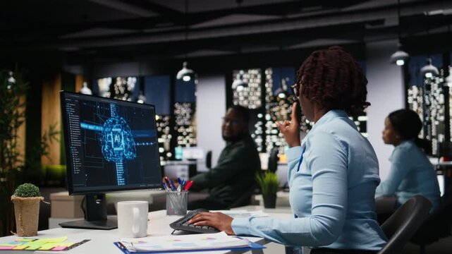 AI assistant displayed on a computer desktop helping black team complete tasks late at night, deep learning to streamline interactions and enhance web based connectivity. Camera A.