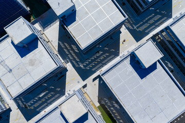 Aerial top view of modern industrial buildings with geometric layout