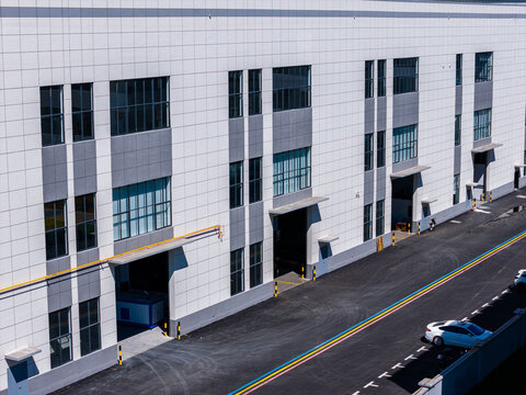 Modern warehouse building exterior with loading docks