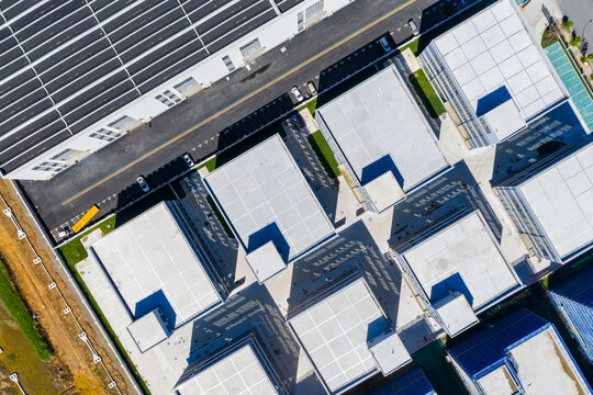 Aerial top view of modern industrial buildings with geometric layout