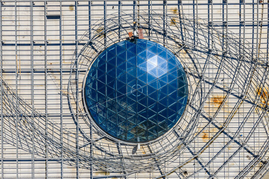 Aerial view of circular glass dome with metal framework