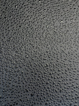 raindrops on black surface
