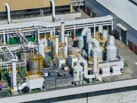 Industrial facility with pipelines and exhaust scrubbers