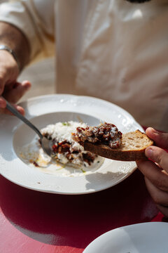 Bread with creamy bean and date topping on a plate