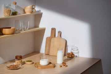 A serene kitchen scene with natural light, wooden accents