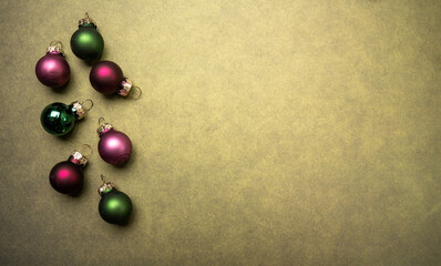 Christmas spheres on color background, with blank space to write a message, mockup