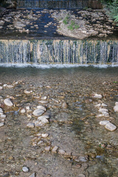 A stream flows through the mountain landscape