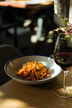Spaghetti with Seafood and Tomato Sauce in White Bowl 