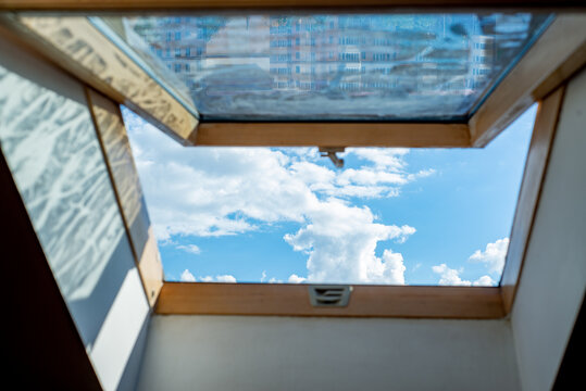 Blue sky view from loft roof window
