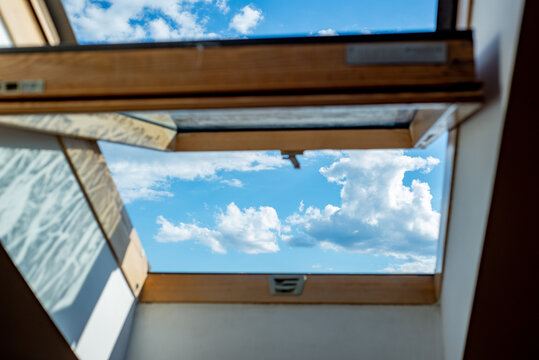 Blue sky view from loft roof window