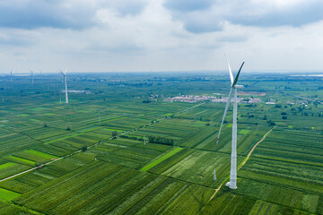 Wind turbines in farmland aerial view