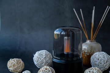 Indoors Decoration with modern lighted Air Humidification Aroma essential oil perfume fragrance. Scented home wellness wellbeing habit. Concept of feeling good spiritual health and being mindful