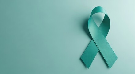 Teal Ribbon Symbolizing Awareness and Support for Ovarian Cancer and Cervical Cancer on a Matching Teal Background