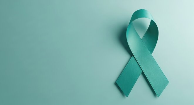 Teal Ribbon Symbolizing Awareness and Support for Ovarian Cancer and Cervical Cancer on a Matching Teal Background - Powered by Adobe