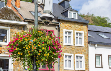 Flowers and a security camera on the square in La Roche-en-Ardenne, Belgium