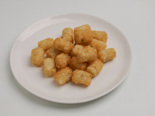 Potato nuggets on white background