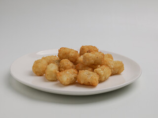 Potato nuggets on white background