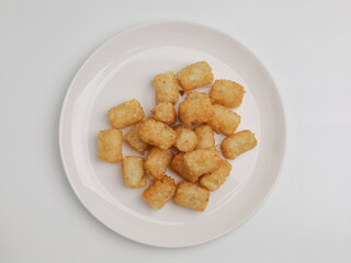 Potato nuggets on white background