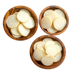 Three wooden bowls, each filled with sliced, white root vegetables. Dark background