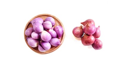 Top view of Red onion on wooden plate. Isolated on white background with copy space. Perfect for design element, ingredients food spices or any commercial usage.