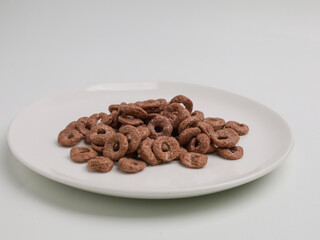 chocolate ring cereals on white background