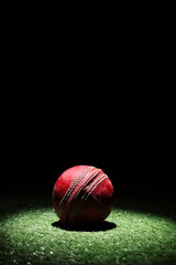Cricket Ball in Spot Light with Black Background