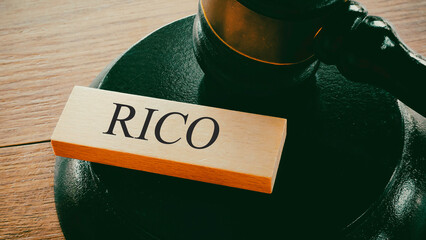 Word RICO on Wooden Block with Gavel and Sound Block Representing Organized Crime Legal Rulings