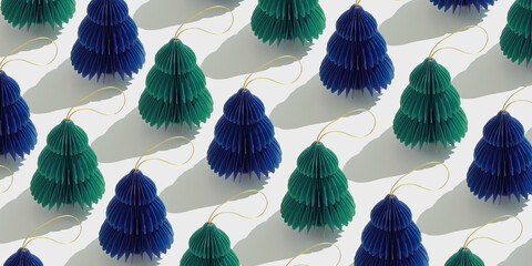 Top view of green blue honeycomb paper Christmas ornaments in minimal trend pattern on light background. New Year fir tree with sun shadows creating rhythmic, graphic banner modern holiday themes.