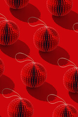 Minimalist top view of red honeycomb paper Christmas ornaments, Crafted round balls as holiday minimal trend pattern, winter seasonal festive red decorations, Happy holidays, Merry Christmas concept