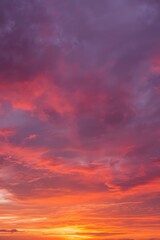Fototapeta premium Vivid colorful sunset sky with stunning pink, purple, and orange clouds creating a dramatic natural gradient, symbolizing beauty, peace, evening atmosphere, and breathtaking nature background for desi