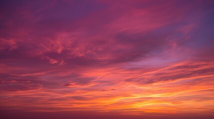 Naklejka premium Vivid colorful sunset sky with stunning pink, purple, and orange clouds creating a dramatic natural gradient, symbolizing beauty, peace, evening atmosphere, and breathtaking nature background for desi