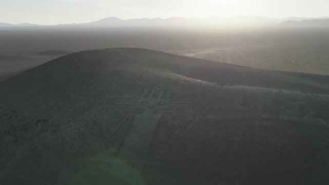 Giant of Tarapaca geoglyph seen from above in the vast Chilean desert terrain
