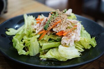Fresh Chicken Salad with Lettuce, Carrots, and Sesame Seeds