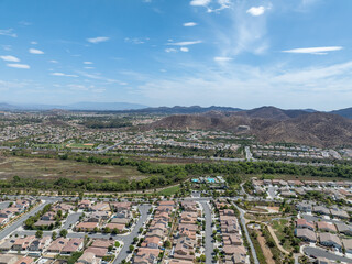 Aerial view of a sprawling neighborhood of family homes in Menifee city in Riverside County, California, United States