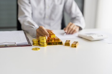 Gold bar Trading business people hand offering gold Investment in gold mining company or Trading gold on the stock exchange Rising prices.