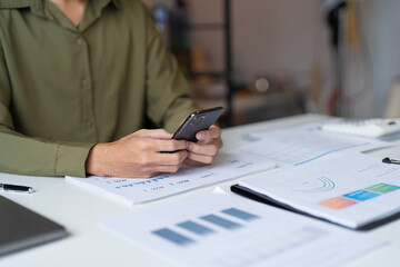 Businessman with Smartphone working mobile devices cell telephone technology e-commerce smartphone business professional investor working new start up project