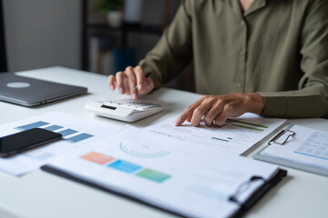 Male Professional Using Calculator for Business Budget Analysis.