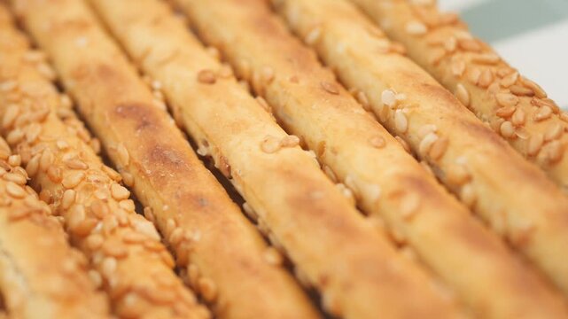 Crispy sesame breadsticks made in a cozy kitchen