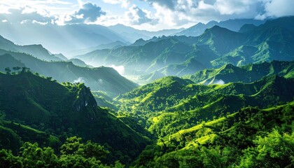 Fototapeta premium Lush Green Mountainous Valley Landscape with Sunlight Streaming Through Mist in a Tropical Location with Blue Sky and Clouds in Daytime