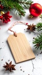 Fototapeta premium Festive composition with wooden tag, ornaments and evergreen