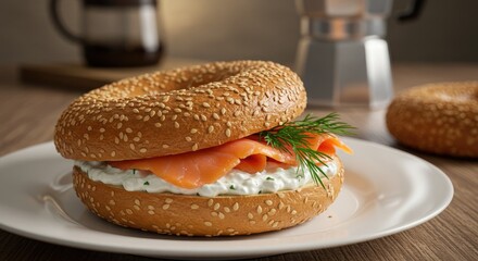 Bagel sandwich with salmon cream cheese on plate close up