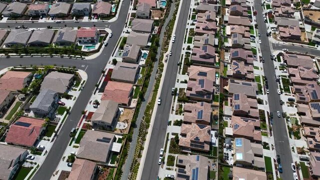 Aerial view of a sprawling neighborhood of family homes in Menifee city in Riverside County, California, United States