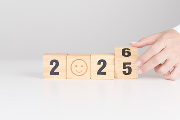 2025 end year to Happy New Year 2026 with Smile block. Satisfaction, feedback, Review, mental health, eco sustainable and good year concept