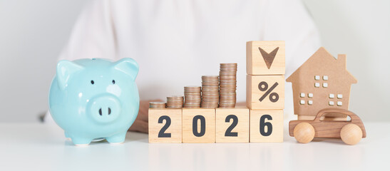 2026 New Year with percentage change to UP and Down arrow, car and Home model with coin stack. Car loan, Interest rate, real estate, house, Insurance, Financial, Repair, Tax, mortgage and Maintenance