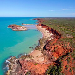 Coastal red cliffs meet turquoise sea