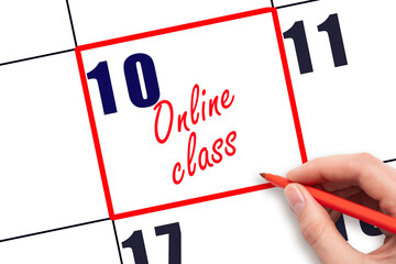 10 th day of the month. Hand writing Online class reminder and drawing red frame on calendar with red pen on white background. Online education concept. Planning and scheduling.